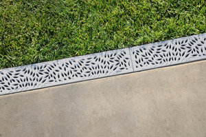 Decorative gray plastic drate for water drainage, lawn and driveway